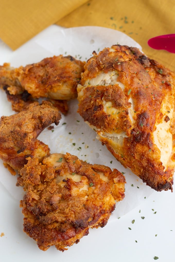 air fried chicken pieces on white background