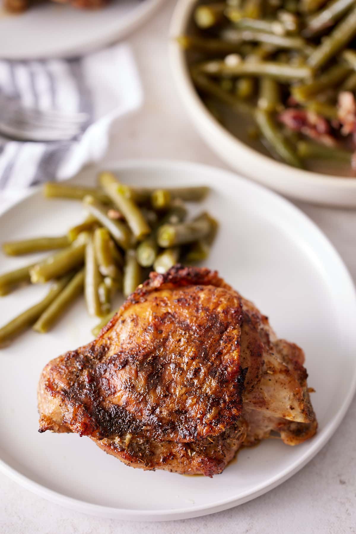 plate of green beans and a turkey thigh