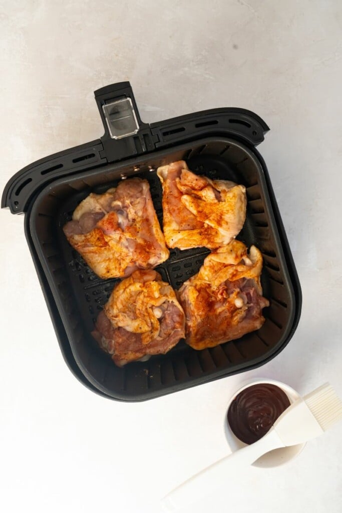 air fryer basket with chicken thighs