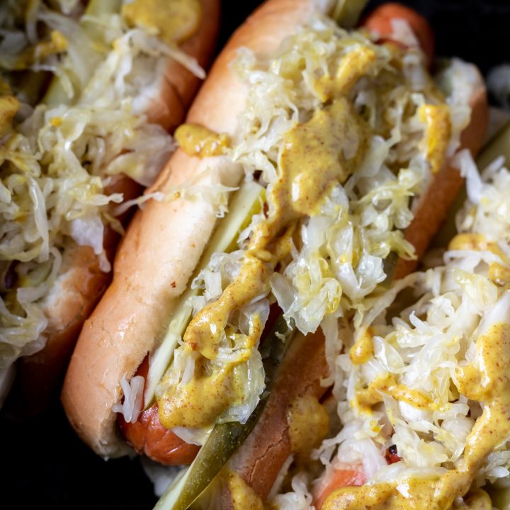 hot dogs in bun with sauerkraut in air fryer basket