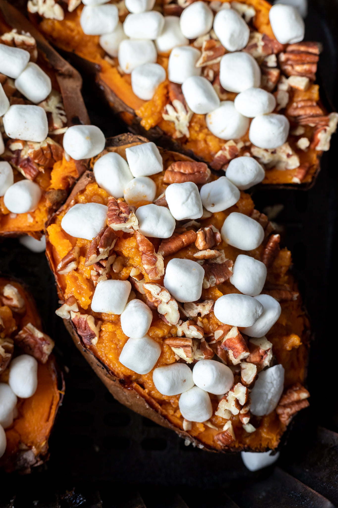 par cooked sweet potatoes in air fryer basket