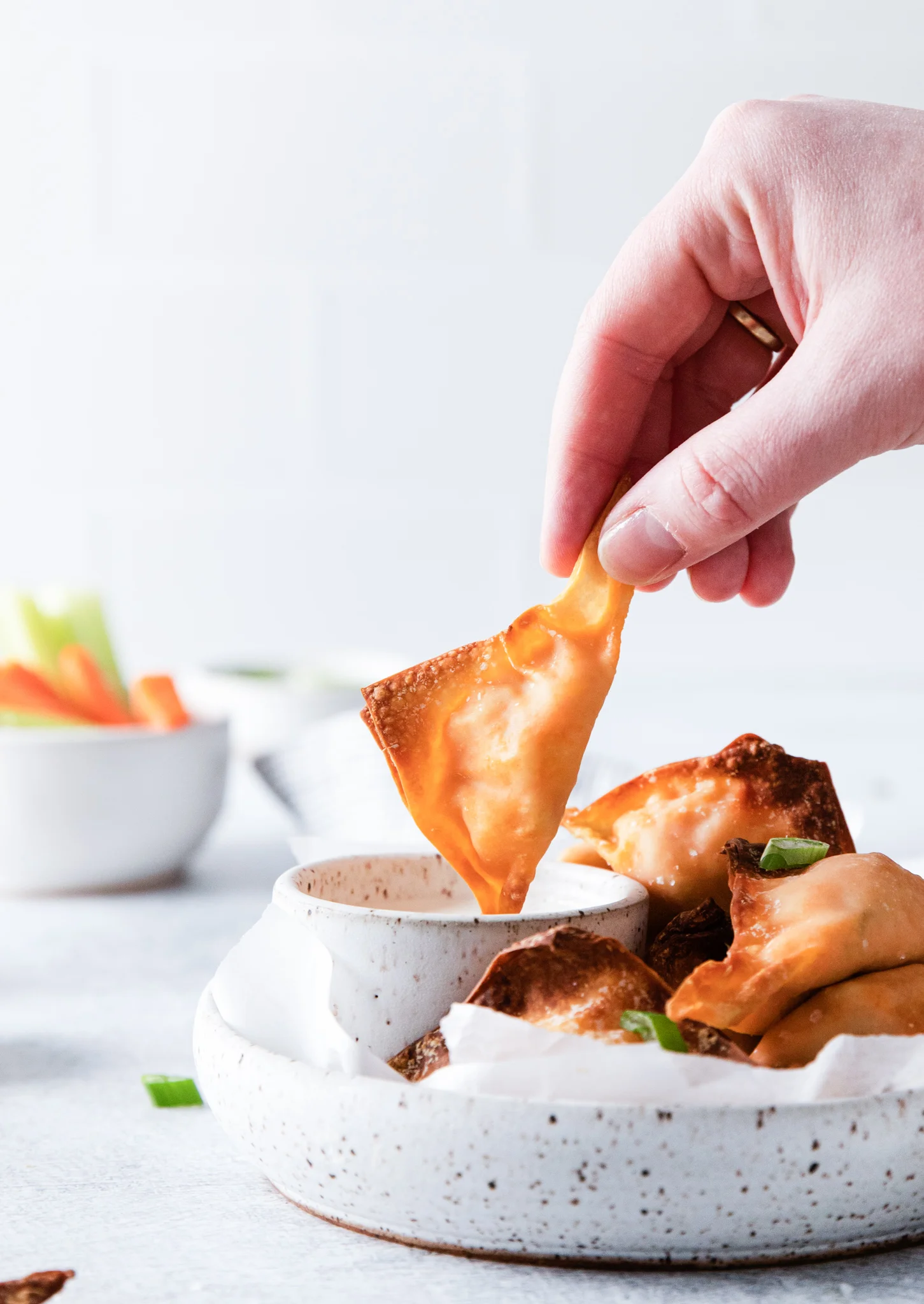 hand holding cooked wonton