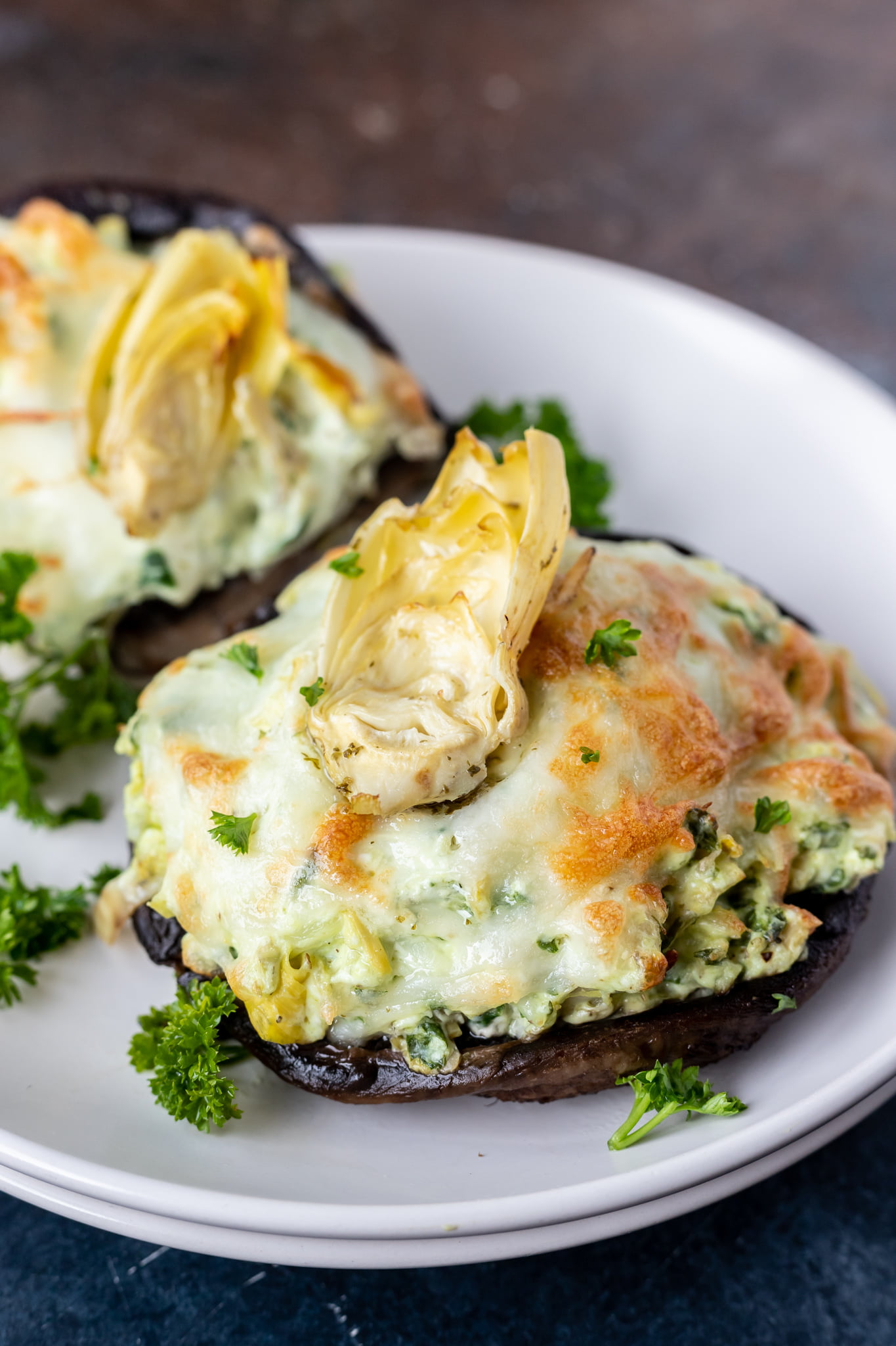 cheese stuffed portobellos on plate