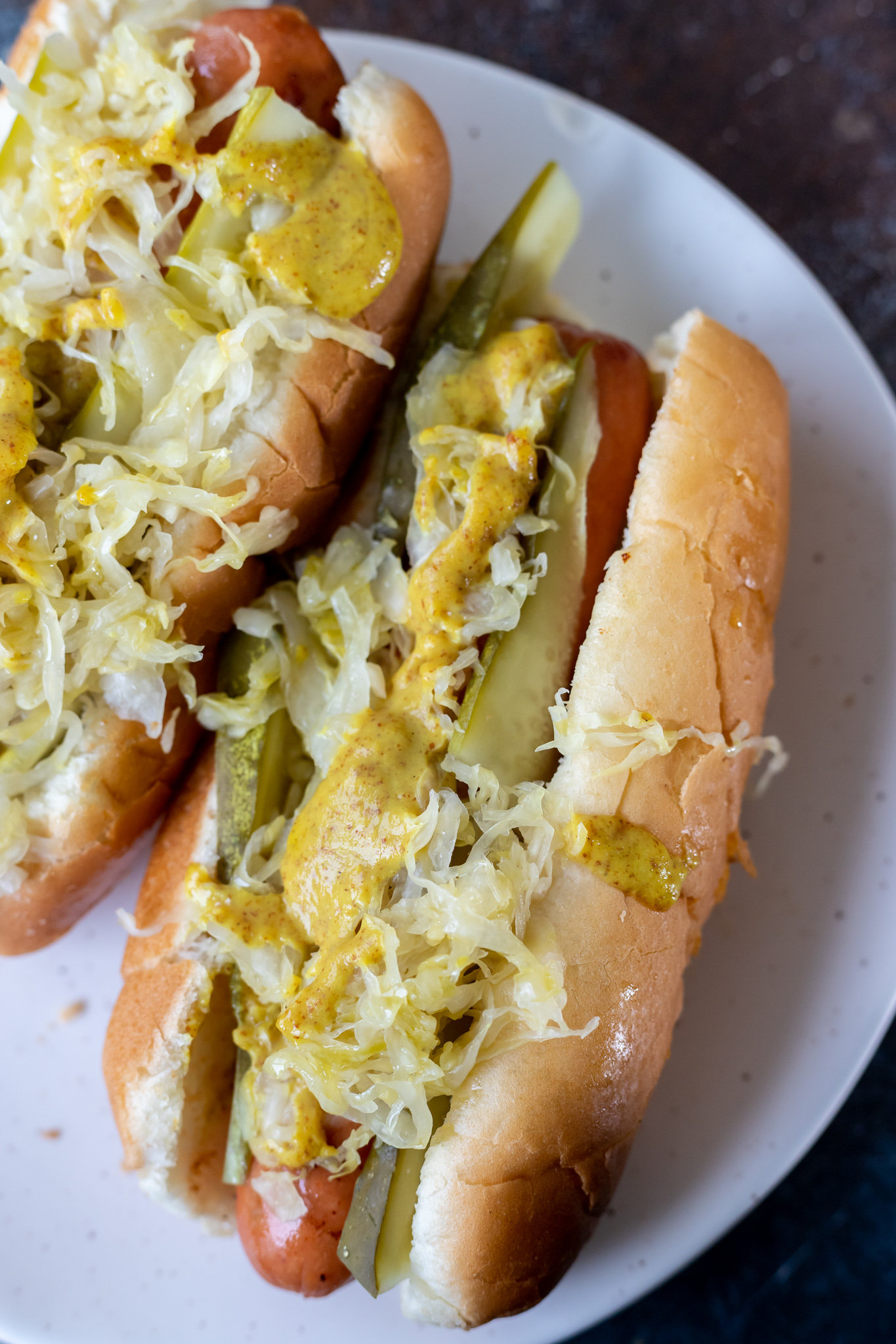 prepared hot dogs on white plate