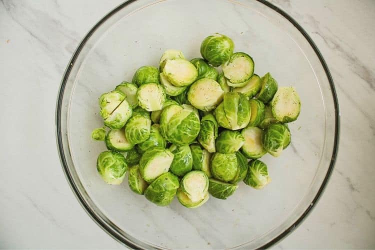 Brussels Sprouts halved in a bowl