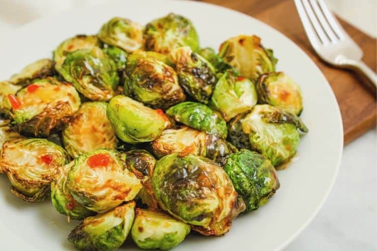 Plated Air Fryer Brussels Sprouts with fork on the side