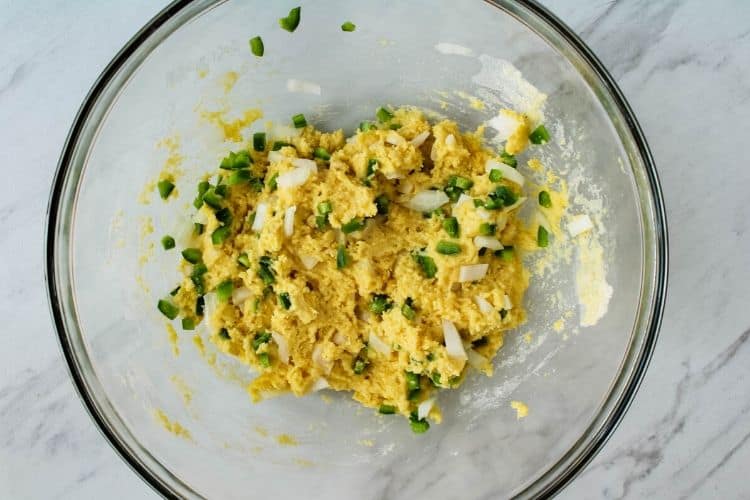 Hush Puppy Mix in bowl with peppers and onions