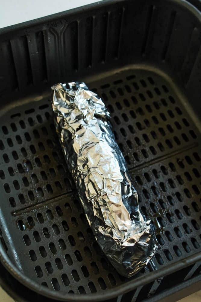 Air Fryer Corn on the Cob in foil inside the air fryer