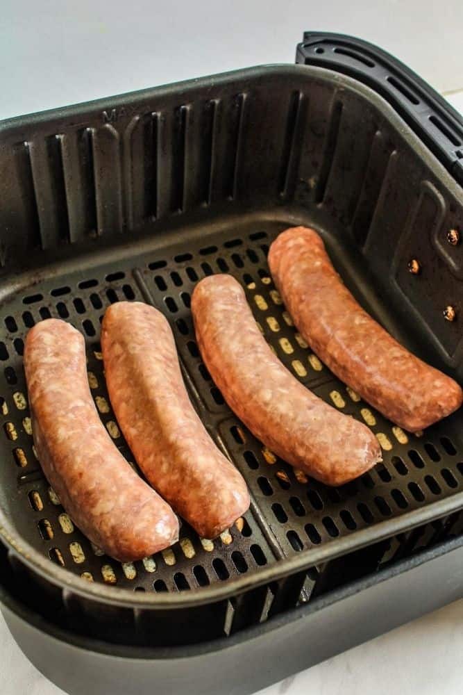 Raw bratwurst inside the air fryer