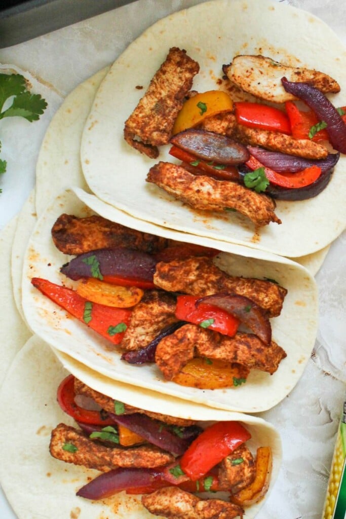 air fryer chicken fajitas inside flour tortillas