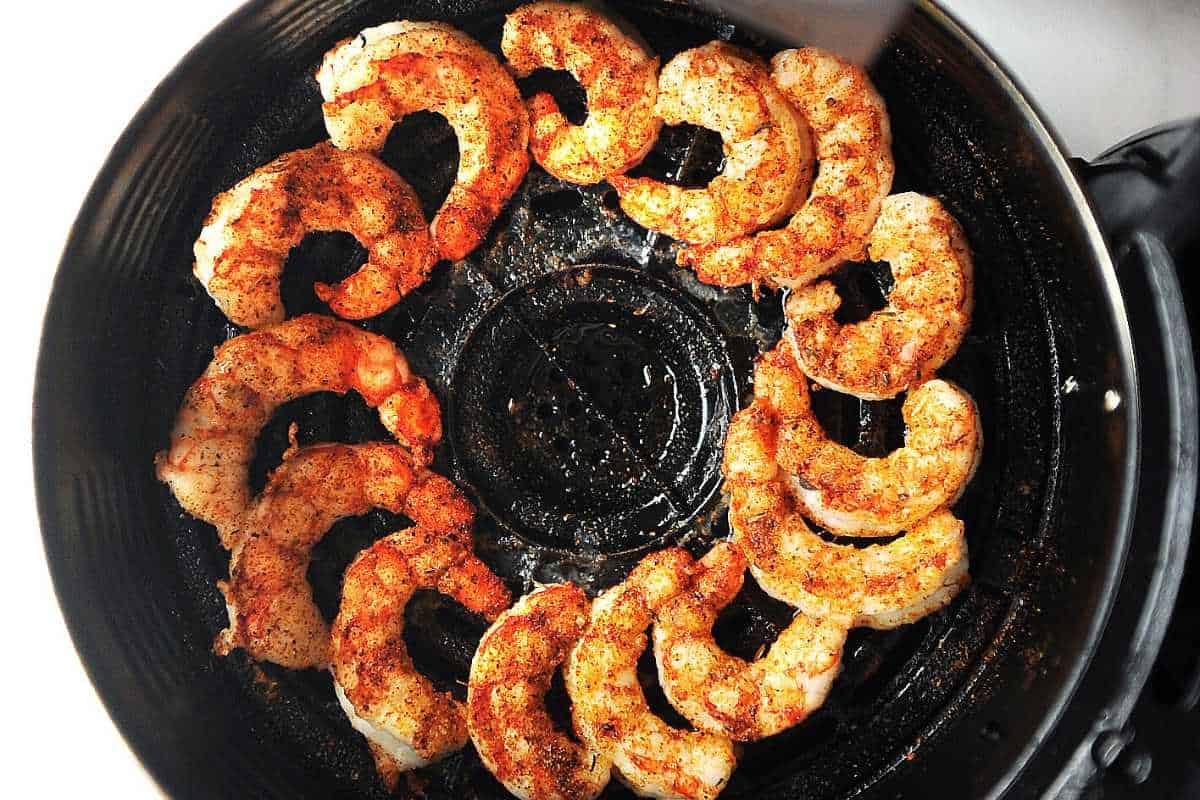 Argentine red shrimp in a black air fryer basket.