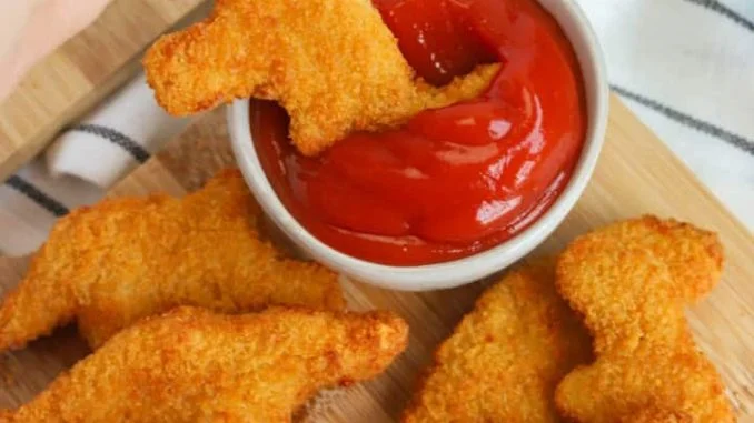 Air-Fryer-Dino-Nuggets-dipping-1-720x1016