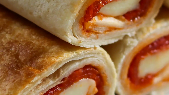 Hot, fresh, and right out of the air fryer - Easy Air Fryer Pizza Rolls are the perfect meal or snack!